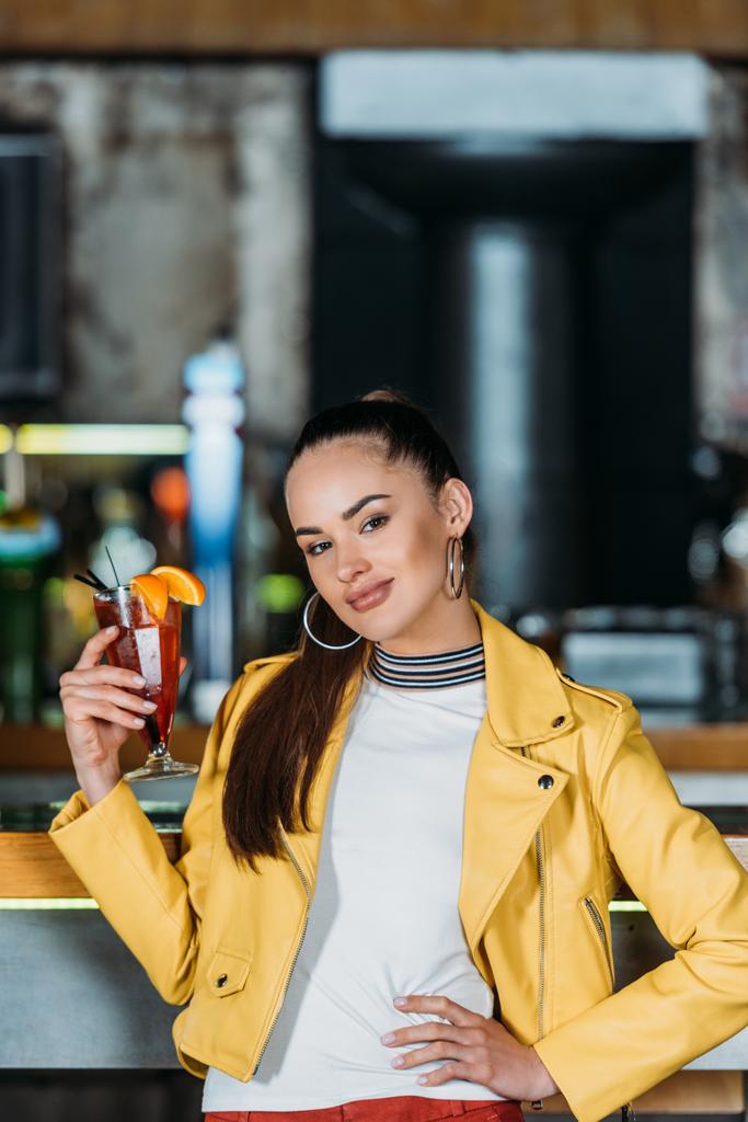 beautiful young woman with cocktail spending time in bar - Photo, Image