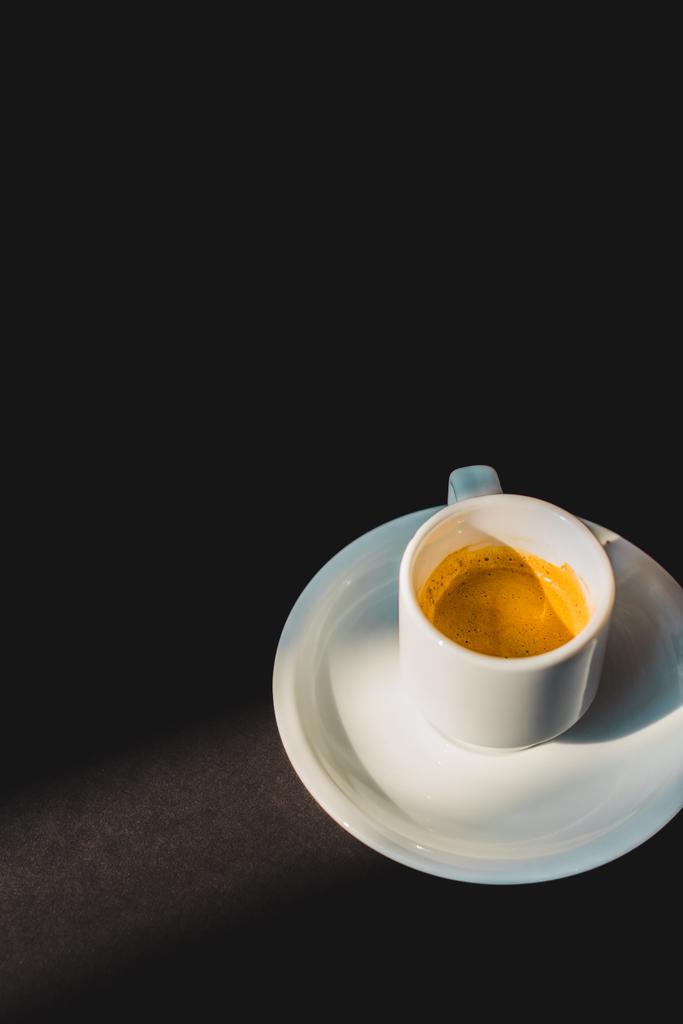 cup of tasty coffee in white cup on black surface - Photo, Image