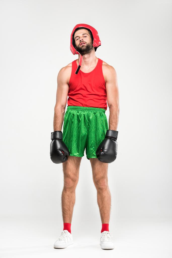 tired boxer in retro helmet and boxing gloves, isolated on white - Photo, Image