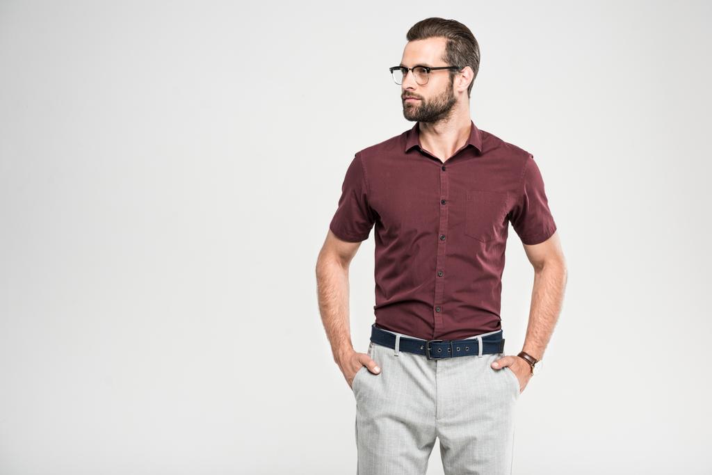 handsome serious man posing in casual closing and glasses, isolated on grey - Photo, Image