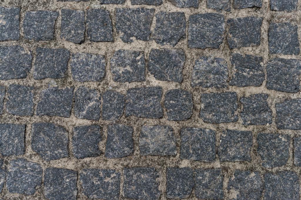 Superfície de estrada de pedras de seixos sujas
 - Foto, Imagem