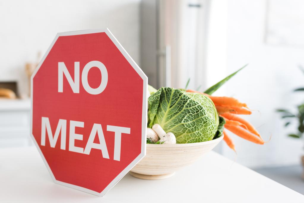 no meat sign and bowl with vegetables on kitchen counter - Photo, Image