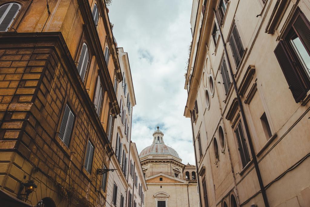 old buildings on street of Rome with cathedral on background, Italy - Photo, Image
