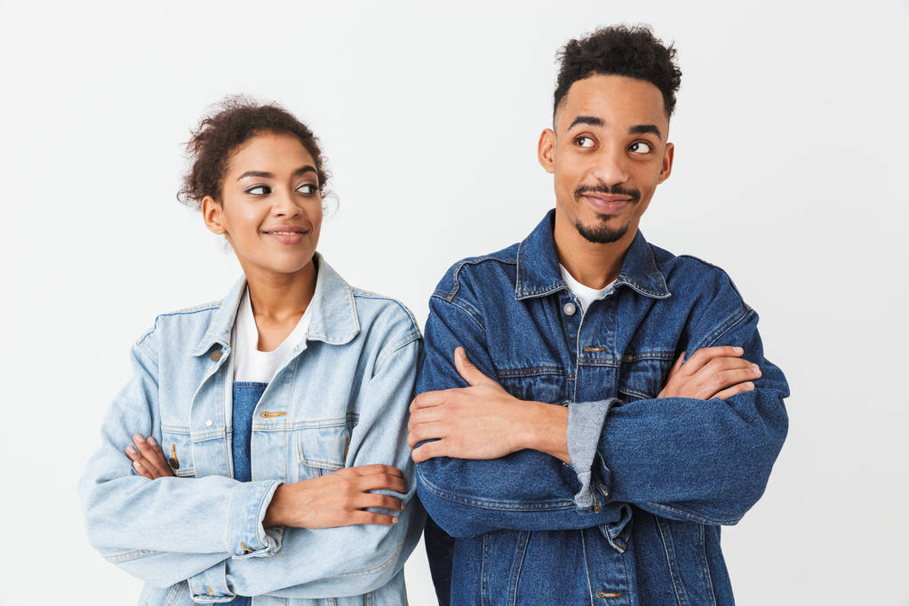 Happy couple in denim shirts posing together with crossed arms - Photo, Image