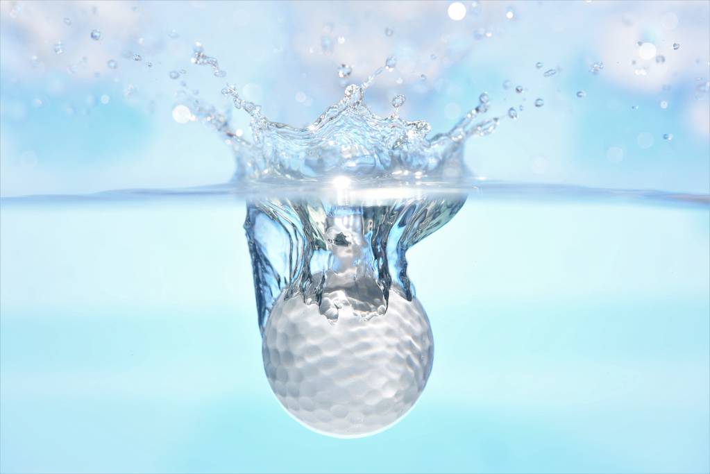 golf ball fall down into water cloud sky background - Photo, Image