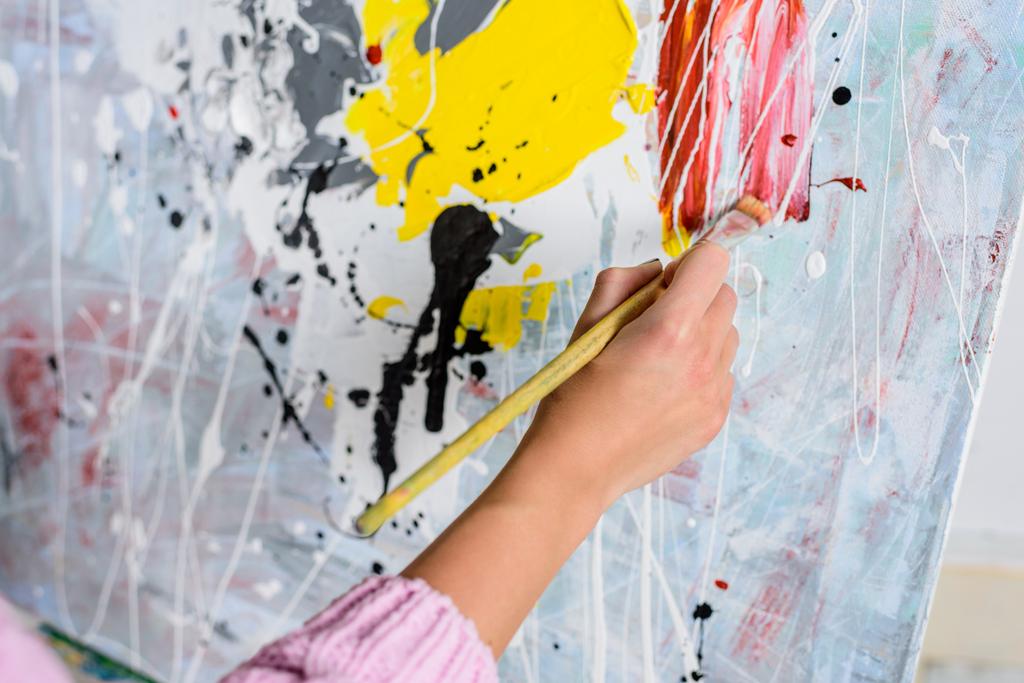 cropped image of female artist painting in workshop - Photo, Image