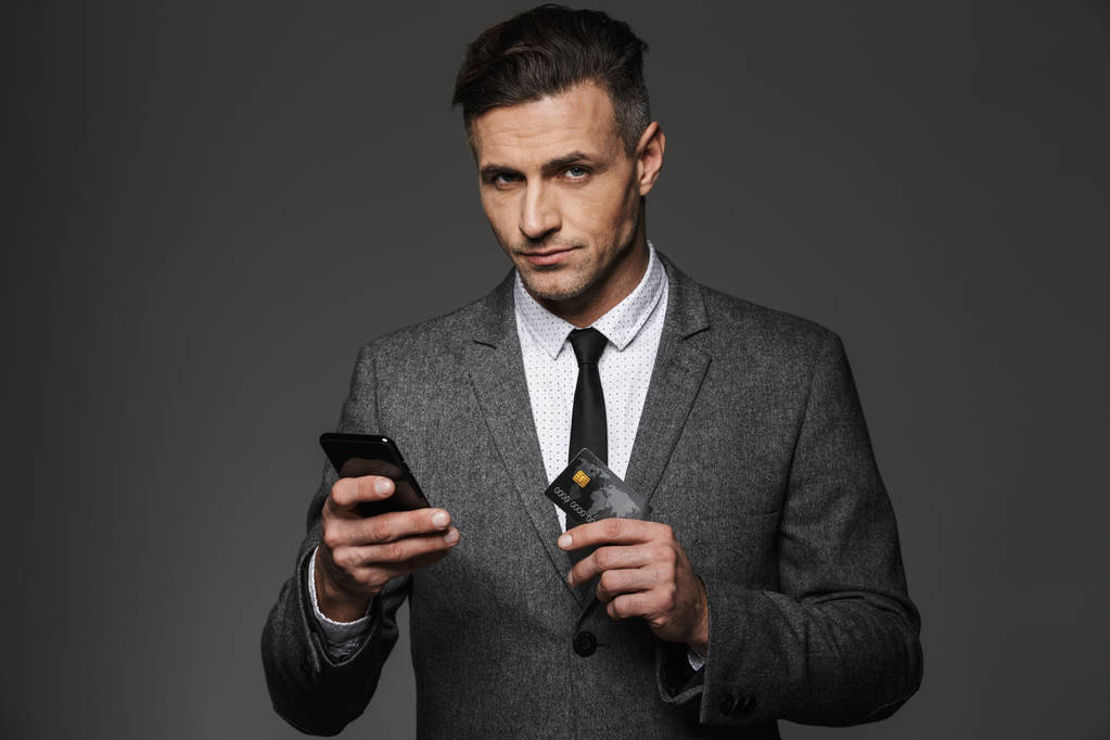 Photo of business chief in formal clothing paying online with sm - Photo, Image