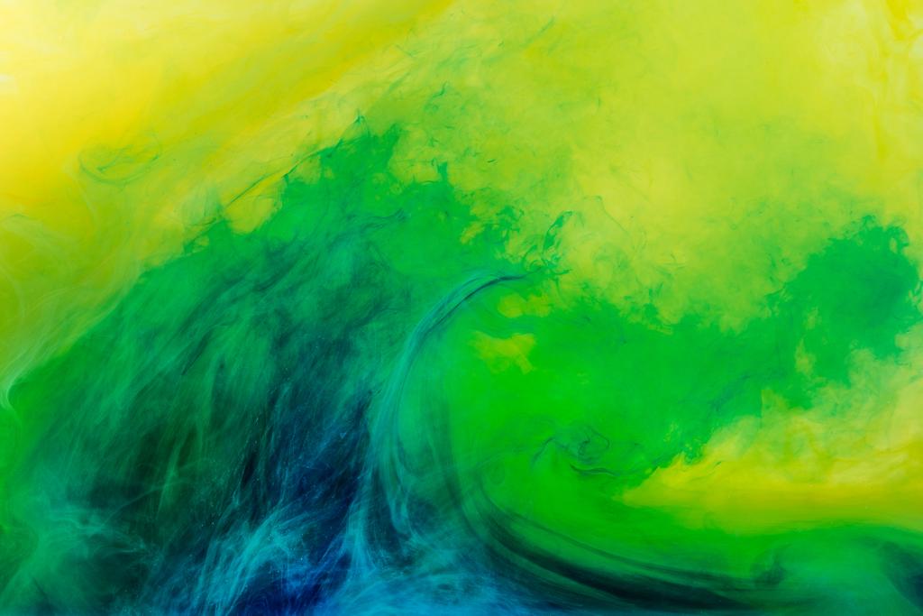 abstract background with green paint flowing in yellow water - Photo, Image
