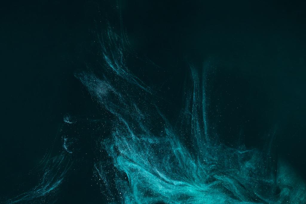 abstract artistic background with turquoise paint flowing on black  - Photo, Image