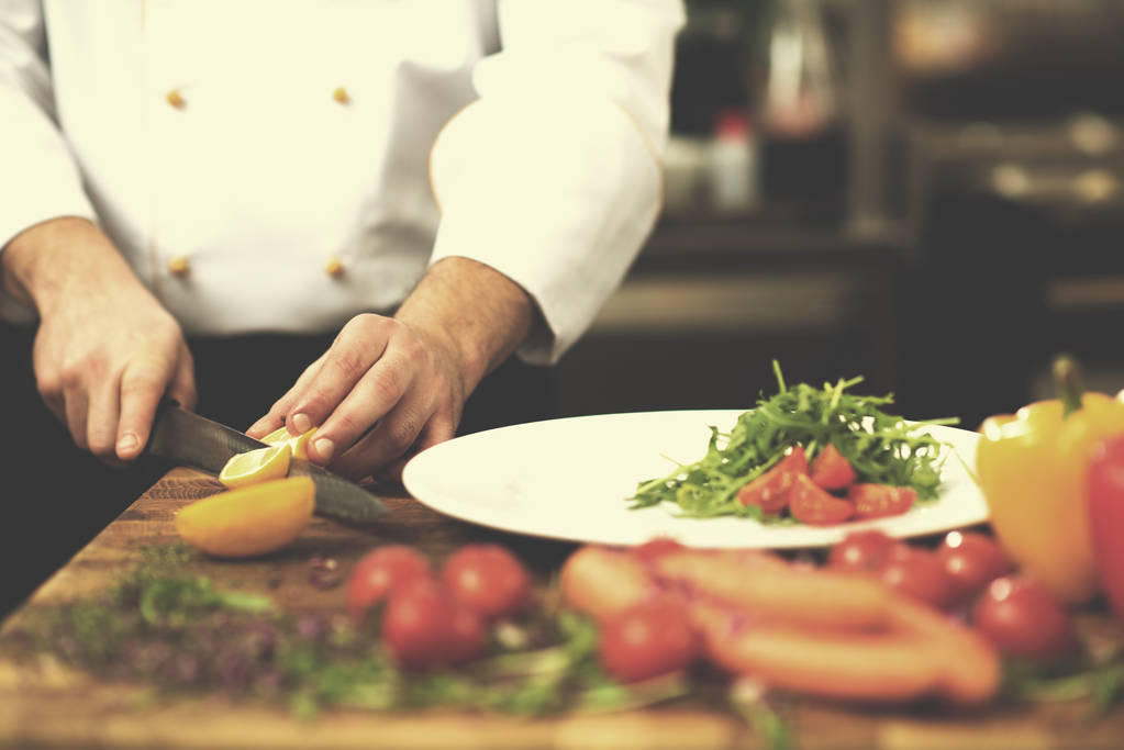 chef serving vegetable salad - Photo, Image
