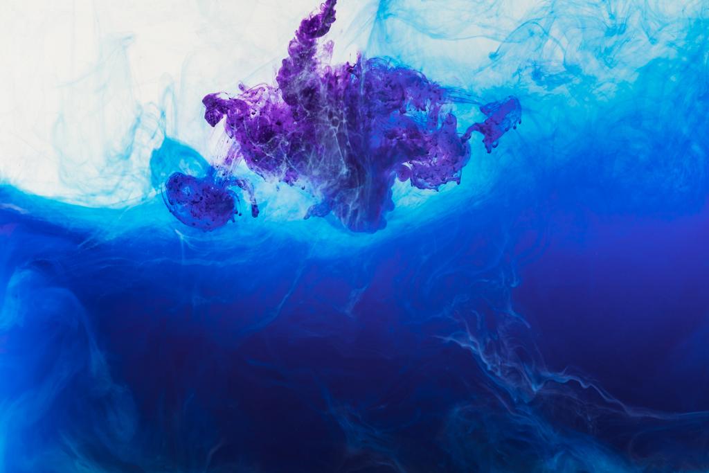 abstract background with blue and purple paint flowing in water - Photo, Image