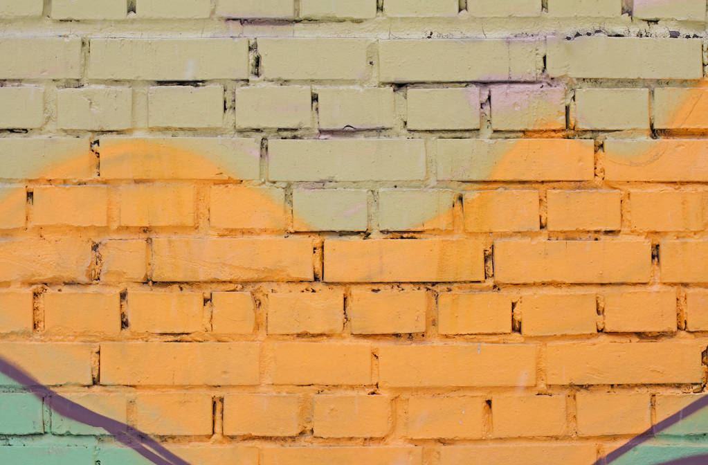 Barevné (žluté, zelené a hnědé) cihlová zeď jako pozadí, textury - Fotografie, Obrázek