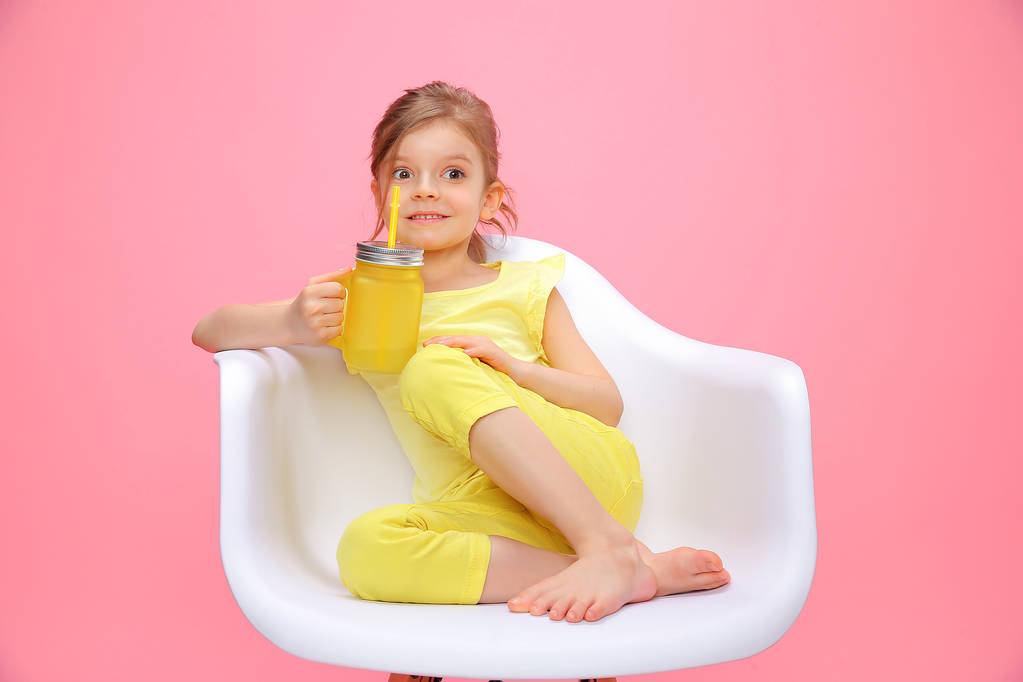 Dreaming young girl with lemonade on pink - Photo, Image