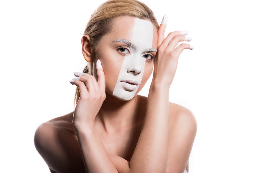 sensual attractive woman with white paint on face looking at camera isolated on white - Photo, Image