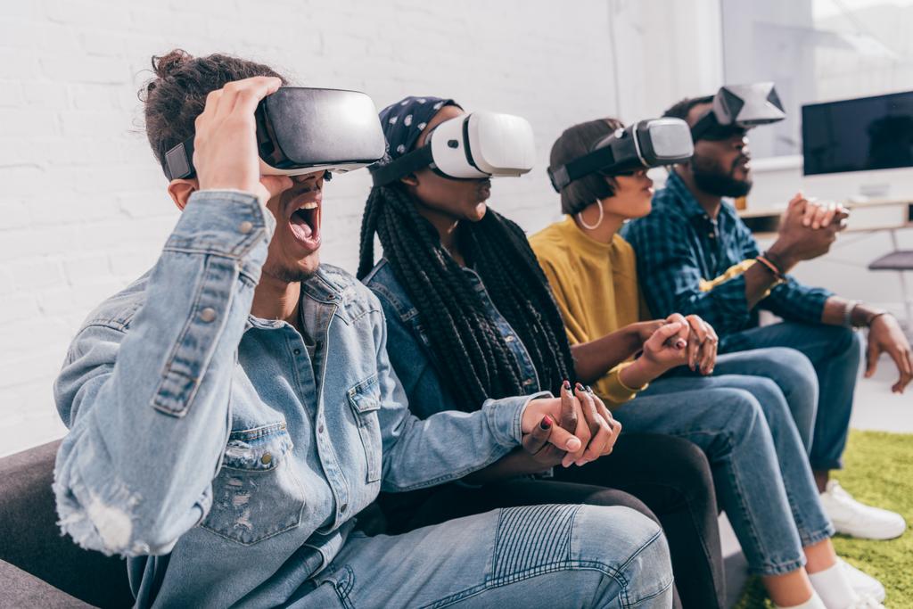 group of young multicultural friends using virtual reality headsets  - Photo, Image