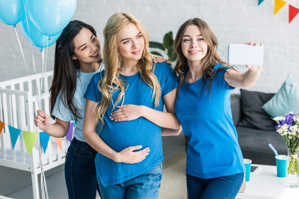 multicultural friends and pregnant woman taking selfie with smartphone at baby-party - Photo, Image