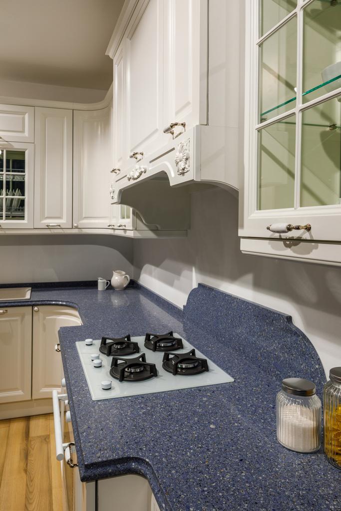 Stylish kitchen with elegant stone counter and stove - Photo, Image