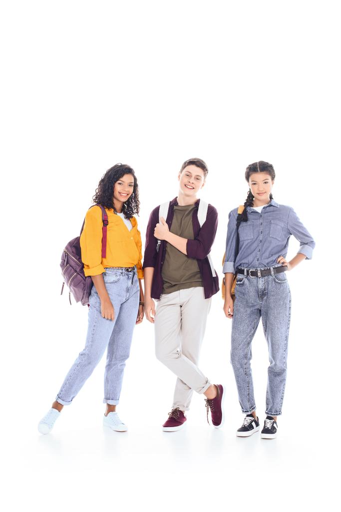 smiling multiethnic students with backpacks looking at camera isolated on white - Photo, Image