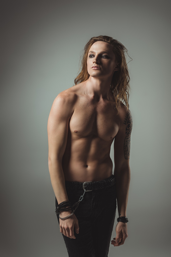 Shirtless Trendy Man With Long Hair Posing Free Stock Photo and Image