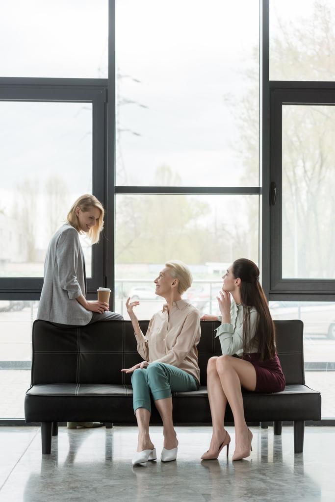 beautiful businesswomen talking during coffee break in office - Photo, Image