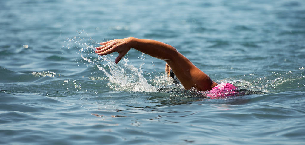 Man swimmer swimming crawl in blue sea,training for triathlon - Photo, Image