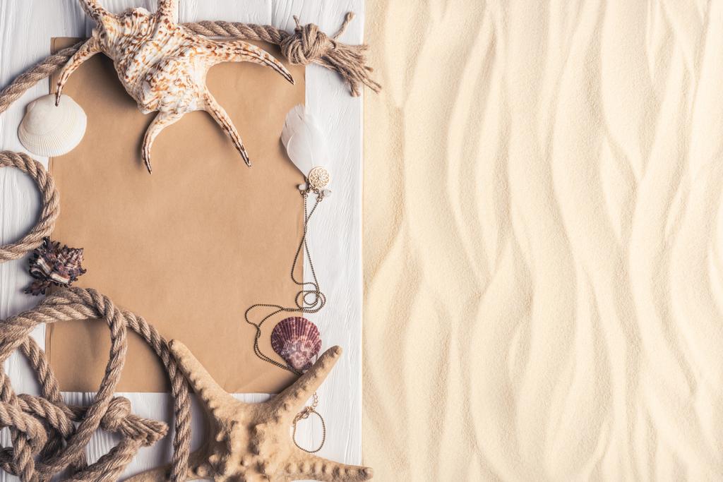 Summer travel template with seashells on sandy beach - Photo, Image