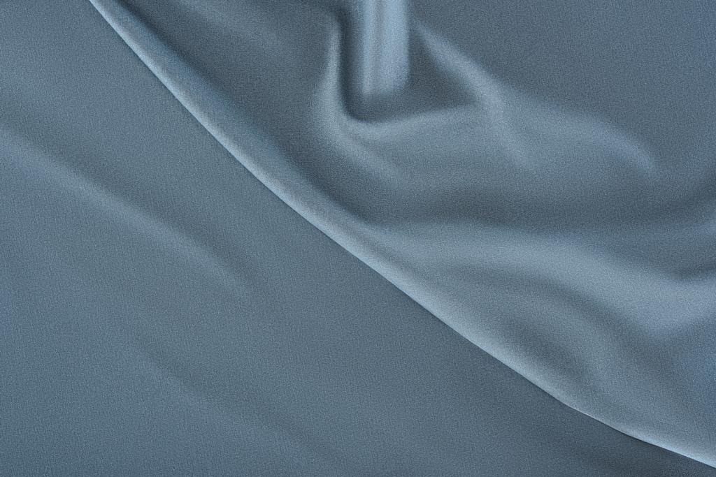 close up view of crumpled blue silk fabric as background - Photo, Image
