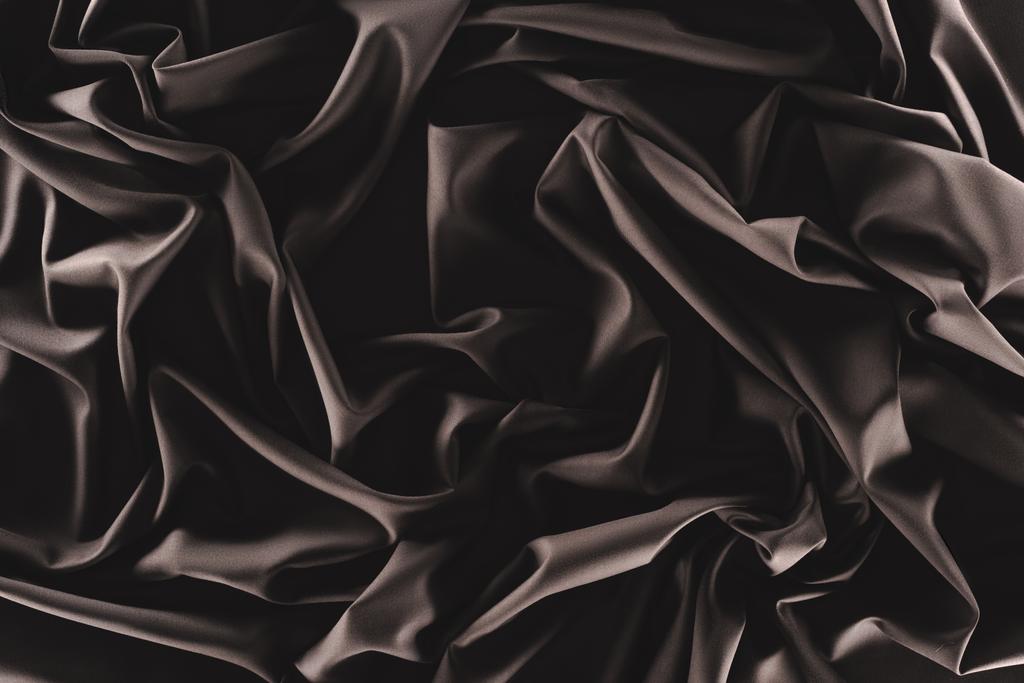 plein cadre de tissu de soie sombre plié comme fond
 - Photo, image