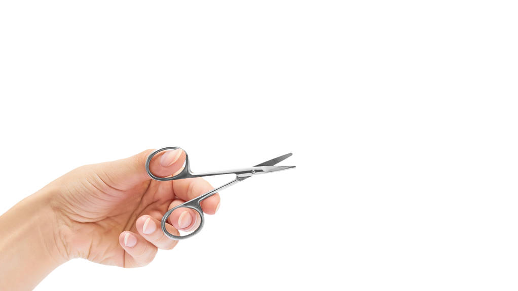 manicure scissors in hand isolated on white background. copy space, template - Photo, Image