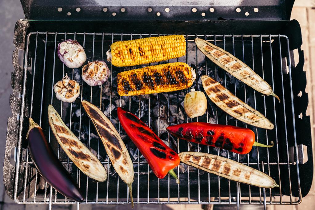Summer seasonal vegetables cooked outdoors on grill - Photo, Image