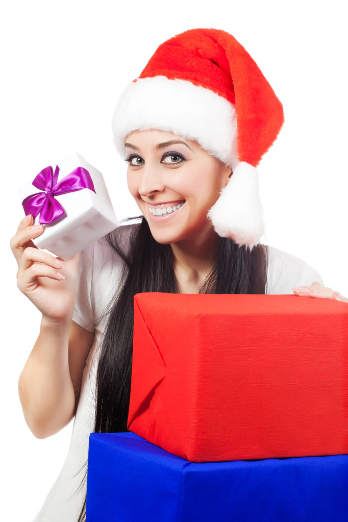 happy woman in a Santa Claus hat with lots of gifts - Photo, Image