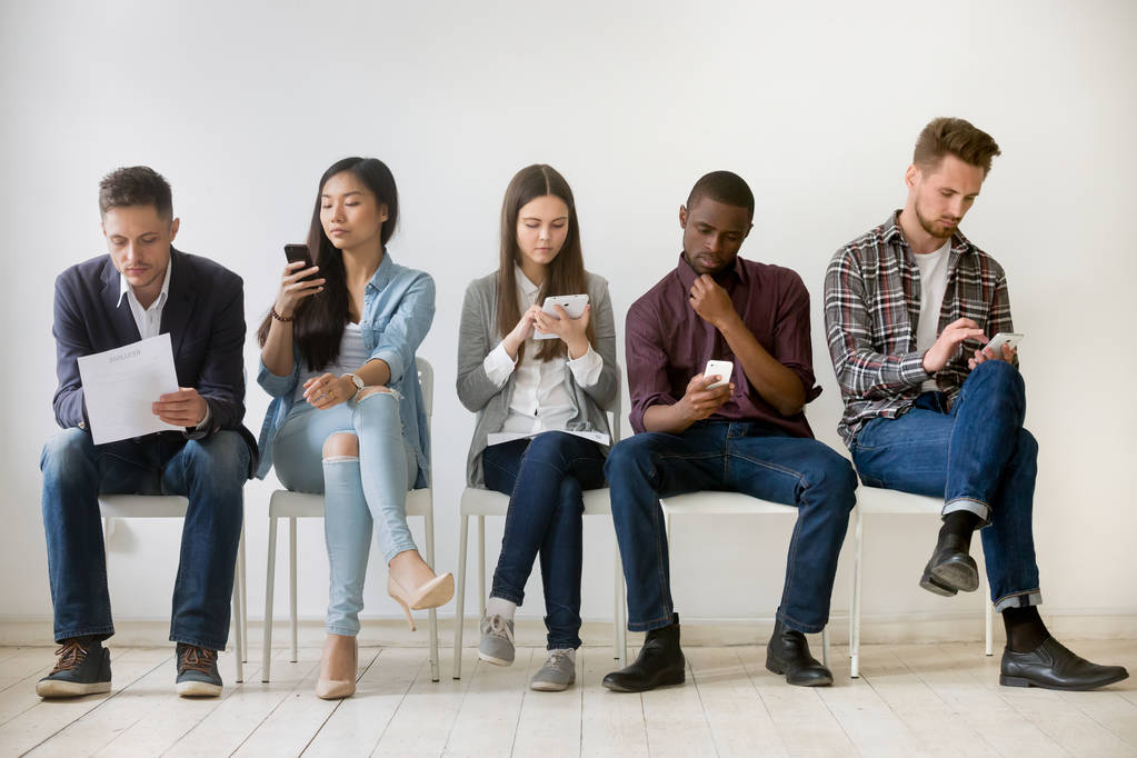 Diverse millennial people waiting in queue holding resumes using - Photo, Image