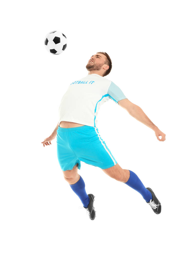 Young man playing football on white background - Photo, Image