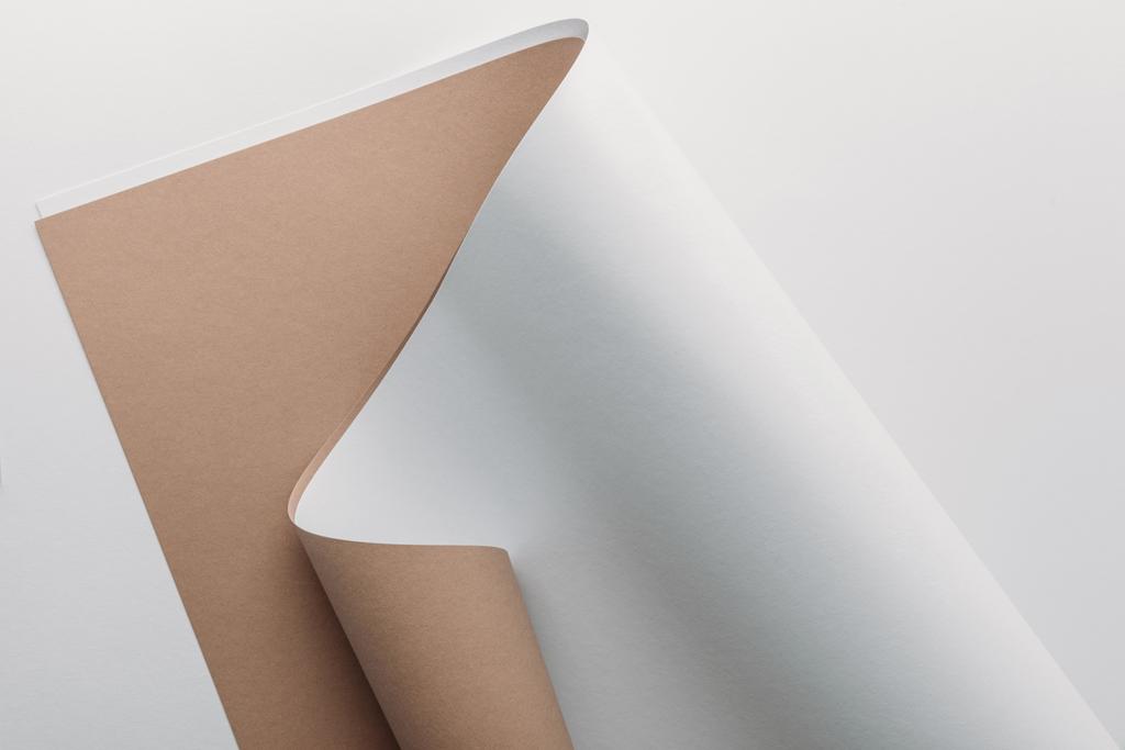 white and brown paper sheets on grey background  - Photo, Image