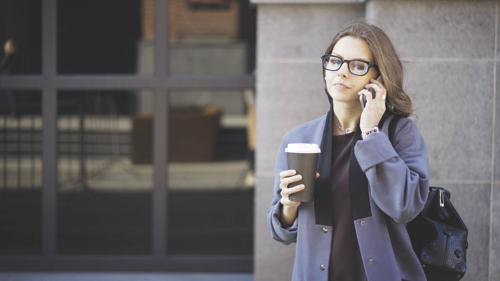 Woman in glasses on the phone, coffee outside - Photo, Image