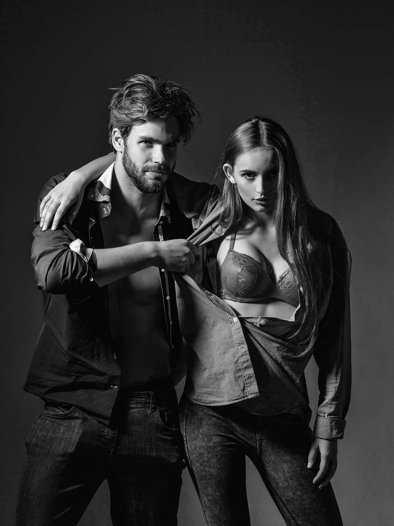 Young couple in unbutton shirts - Photo, Image
