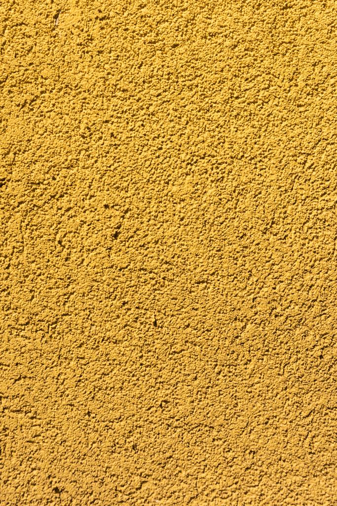 Nahaufnahme der gelben rauen Wand strukturierten Hintergrund - Foto, Bild