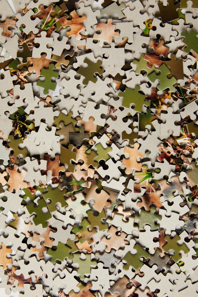 top view of jigsaw puzzle pieces background - Photo, Image