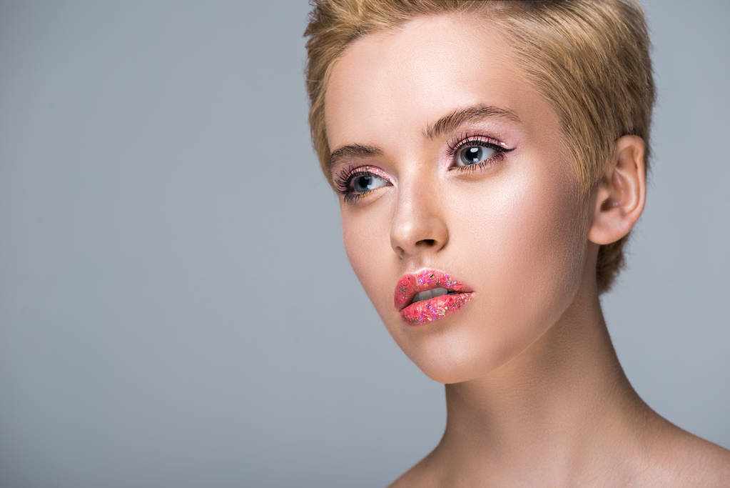 attractive woman with glitter on lips and short hair looking away isolated on grey - Photo, Image