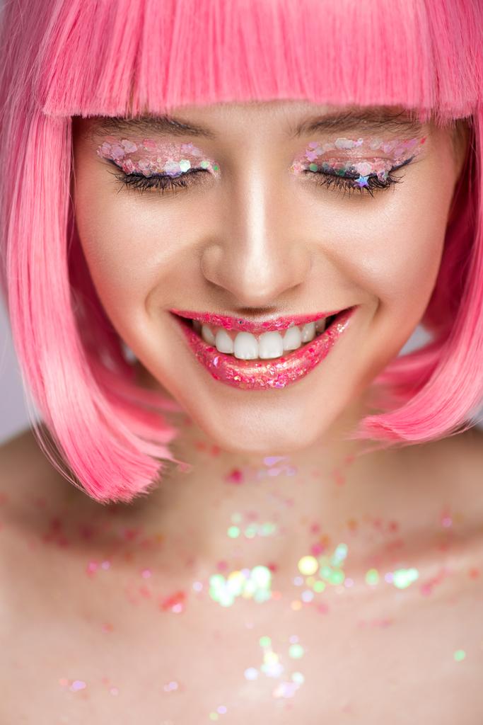 smiling attractive woman with pink hair and glitter on face - Photo, Image