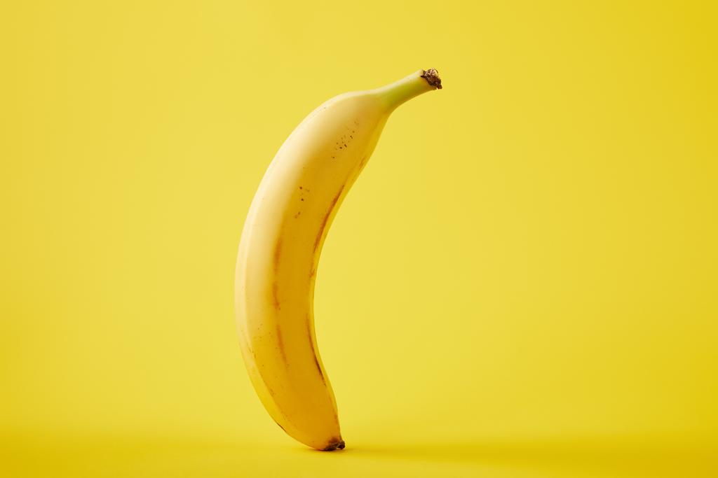 close up view of fresh banana isolated on yellow - Photo, Image