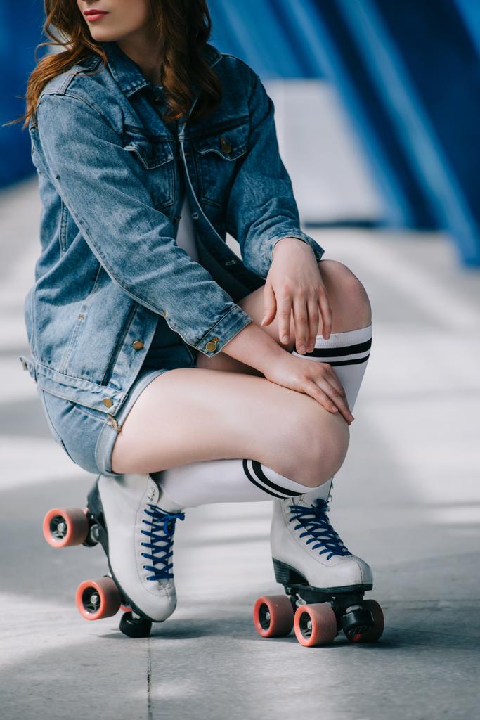 partial view of stylish woman in denim clothes, high socks and retro roller skates - Photo, Image