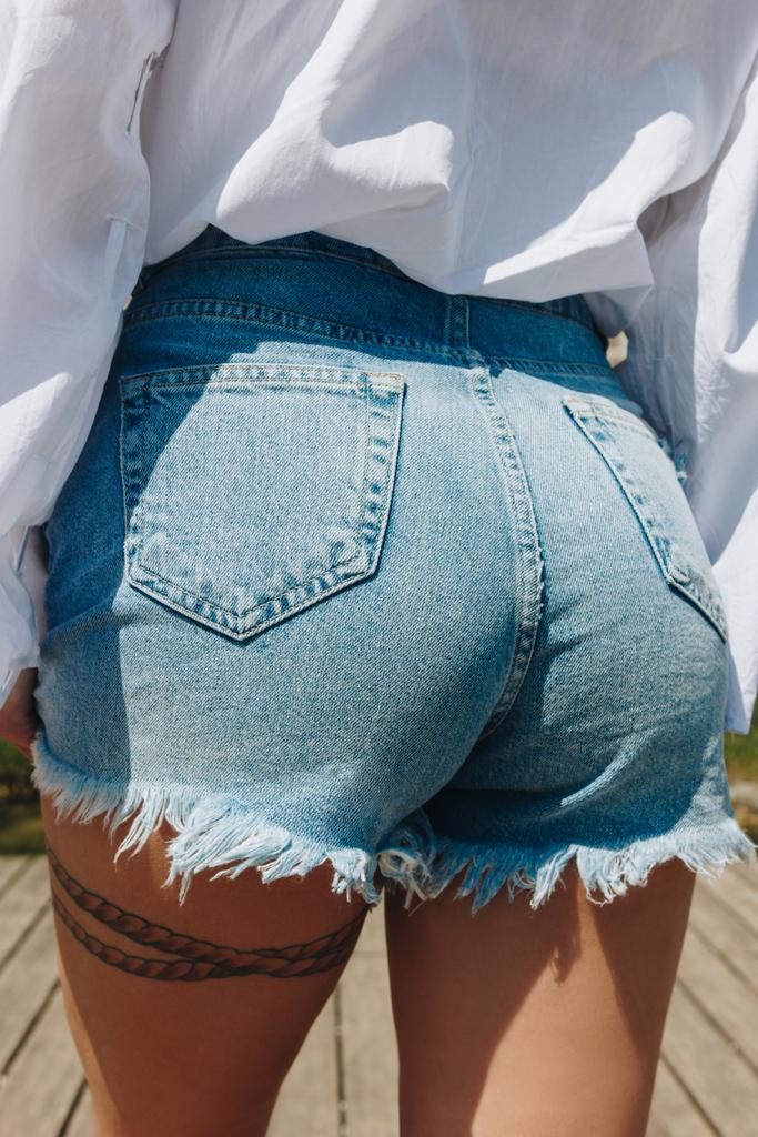 close-up view of beautiful female buttocks in stylish denim shorts - Photo, Image