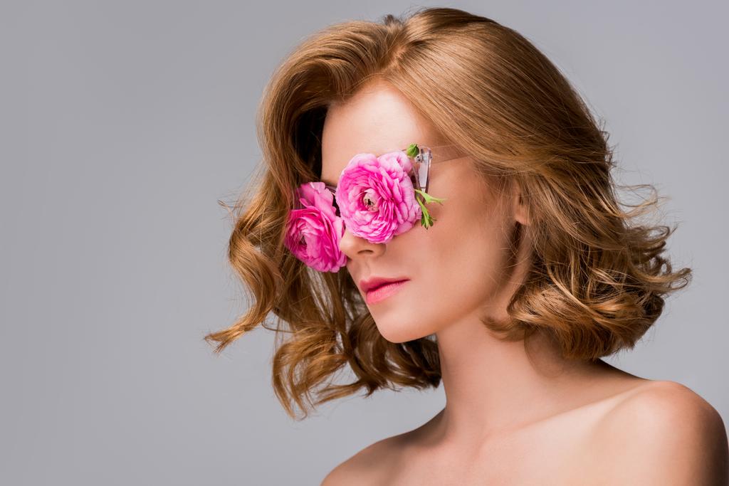 young naked woman wearing glasses with flowers isolated on grey - Photo, Image