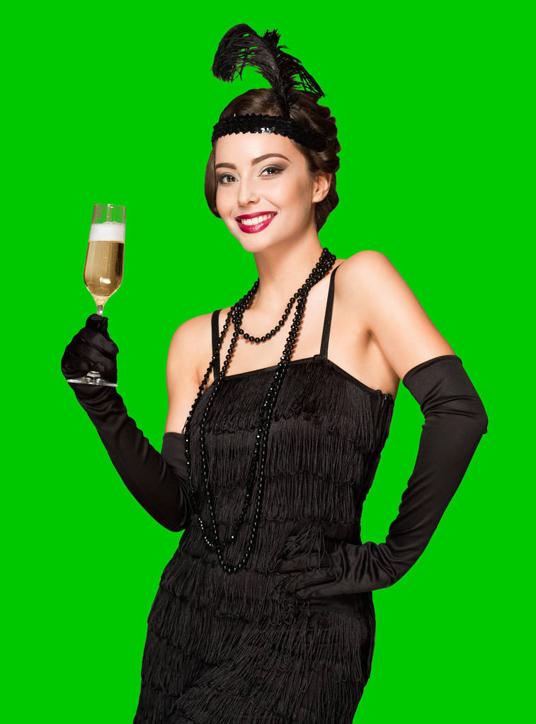Portret van 20s stijl feestelijke schoonheid met glas champagne. - Foto, afbeelding