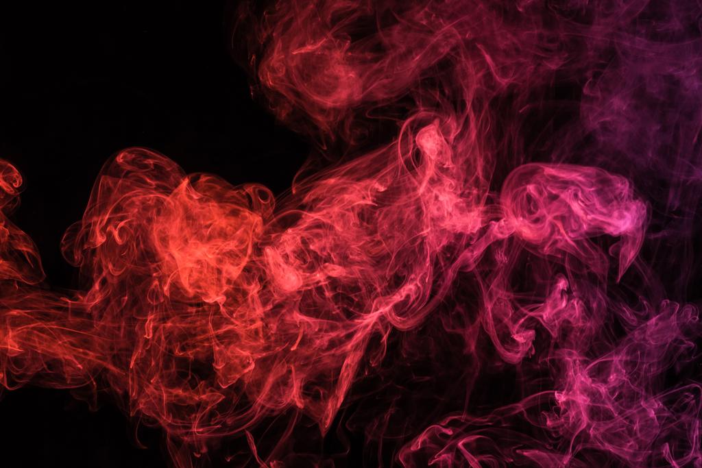 rode spirituele rokerige swirl op zwarte achtergrond - Foto, afbeelding