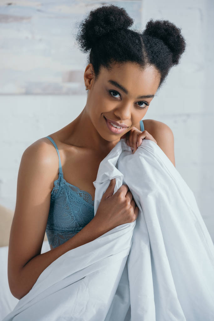 attractive smiling african american girl in lingerie in morning  - Photo, Image