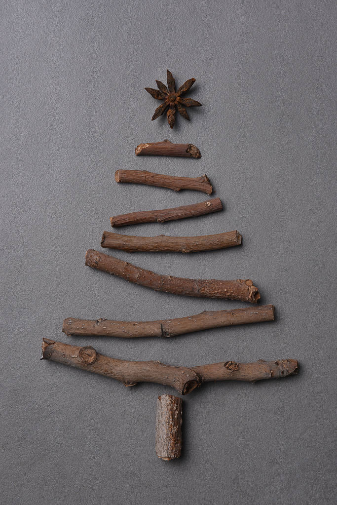 Christmas tree shape made with twigs and a star of anise seed.  - Photo, Image