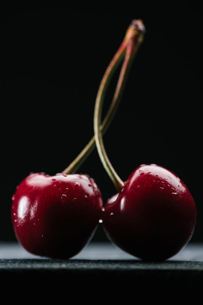 close-up view of fresh wet sweet cherries on black - Photo, Image