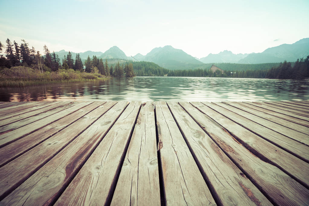 Forest Alpine mountain lake and wooden board background - Photo, Image
